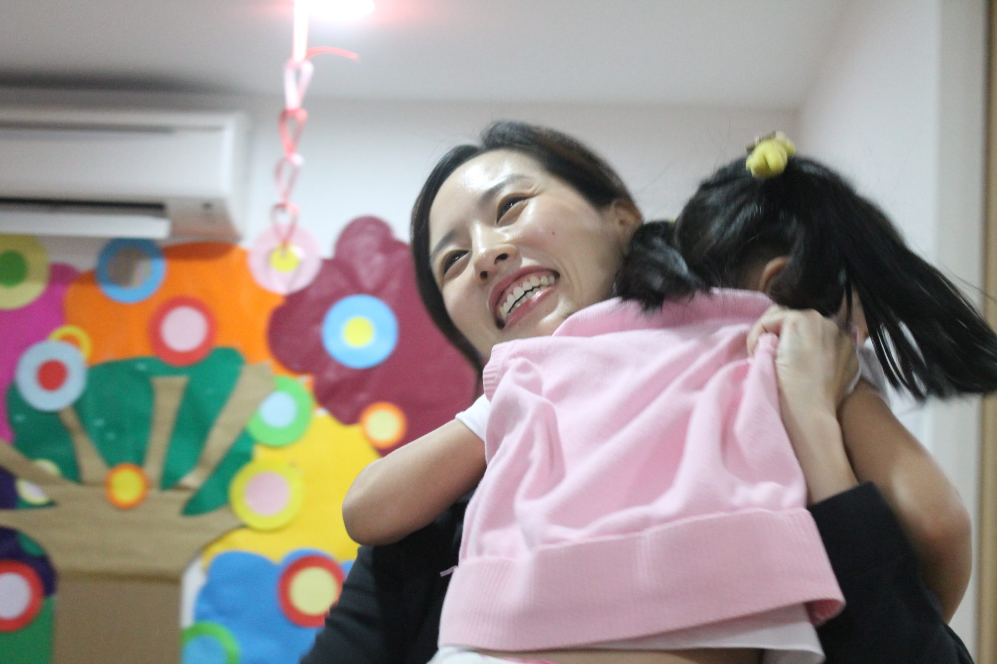 Joykids mother hugging child at JoyKids International Preschool, Bandar Utama
